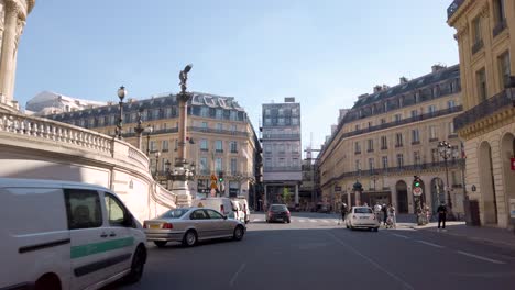 Pedestrians-and-cars-on-street-of-Paris-in-France