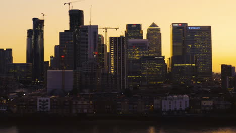 Aerial-view-of-London-Business-financial-district,-Canary-Wharf,-Isle-of-Dogs,-Canada-Square-with-an-awesome-sunset