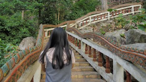 girl-walking-up-to-monkey-mountain-sa-kaeo-in-thailand