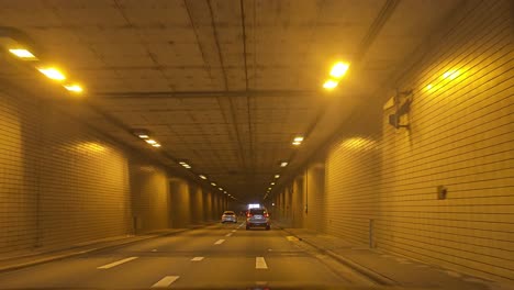 POV-wide-angle-driving-footage-of-entering-a-tunnel