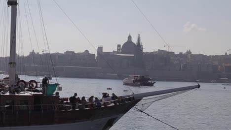 View-of-Malta's-coastline-with-the-dome-of-the-Basilica-Sanctuary-of-Our-Lady-of-Mount-Carmel-in-the-background