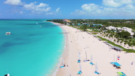 Stunning-forward-aerial-4K-footage-of-Grace-Bay-Beach-with-white-sand-and-turquoise-waters