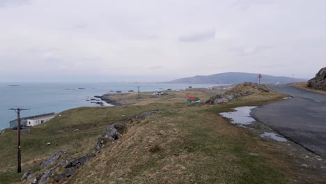 Rugged-landscape-and-ocean-view-of-remote-isle-of-Eriskay-in-the-Outer-Hebrides-of-Scotland-UK