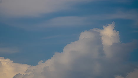 Timelapse-shot-of-white-Cumulus-cloud-movement-along-blue-sky-at-daytime