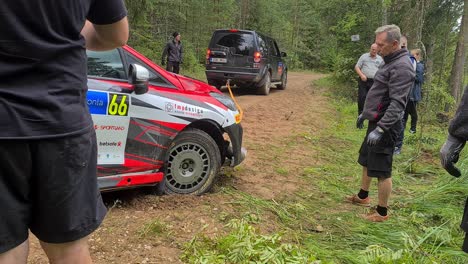 frontal-axis-is-broken-on-wrc-car-and-other-car-tries-to-pull-it-straight