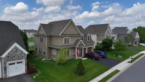 Aerial-view-of-single-family-homes-with-proud-american-flag-in-entrance