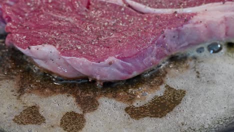 Closeup-of-entrecote-beef-frying-in-butter