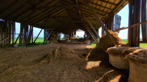 Sunlit-barn-interior-with-piles-of-straw-and-hay-bales