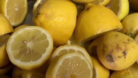 Close-up-shot-of-half-sliced-lemons-ready-to-be-squeezed-into-a-delicious-healthy-juice