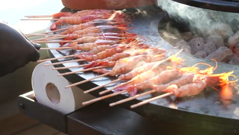 tasty-prawns-cooking-on-the-grill-in-the-evening-light