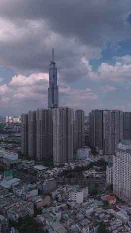 Vertical-video-of-landmark-building-and-central-park,-Ho-Chi-Minh-City,-Vietnam