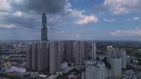 Vertical-video-of-landmark-building-and-central-park,-Ho-Chi-Minh-City,-Vietnam