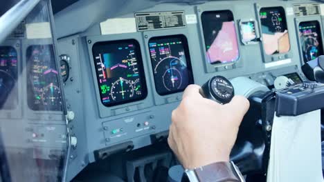 Close-up-view-of-the-hand-of-a-white-pilot-landing-a-jet-aircraft