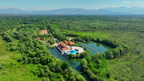 Establishing-drone-shot-of-the-Plavnica-Eco-Resort,-in-Skadar-lake,-Montenegro