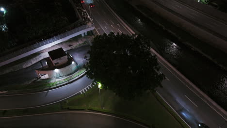 Aerial-tilt-shot-revealing-the-illuminated-Saloma-Link,-night-in-Kuala-Lumpur