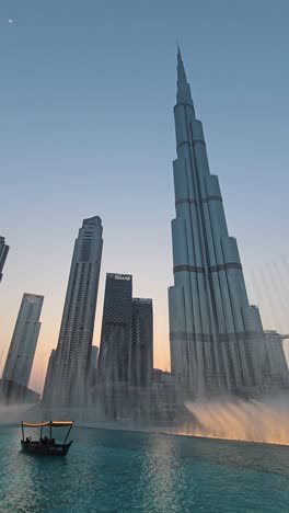 The-world's-tallest-building,-Burj-Khalifa,-set-against-the-dazzling-display-of-the-Dubai-Fountain-show-at-Dubai-Mall,-United-Arab-Emirates