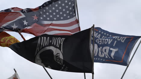 American-And-POW-MIA-Flags-Waving-At-50th-Dogwood-Festival-In-Siloam-Springs,-Arkansas