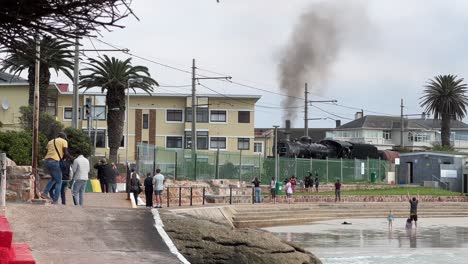 Steam-train-traveling-along-the-coast