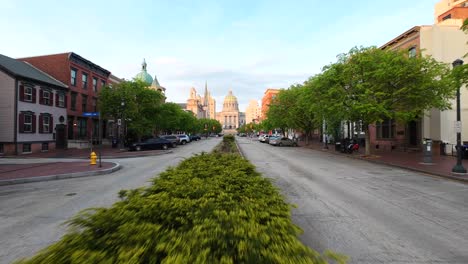 Low-FPV-drone-shot-above-median-of-State-Street-in-downtown-Harrisburg