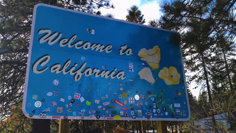 Welcome-to-California-Road-Sign,-Lake-Tahoe-State-Border-With-Nevada-USA