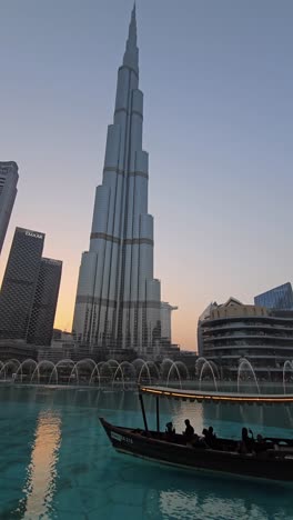 The-world's-tallest-building,-Burj-Khalifa,-set-against-the-dazzling-display-of-the-Dubai-Fountain-show-at-Dubai-Mall,-United-Arab-Emirates