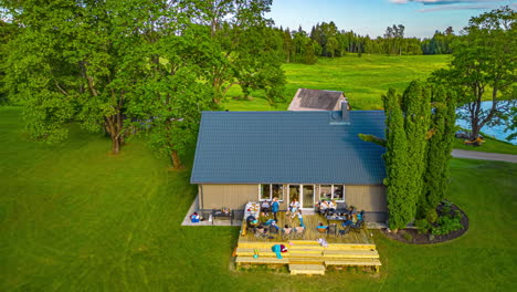 Sunset-party-at-a-rural-cabin---aerial-zoom-in-hyper-lapse