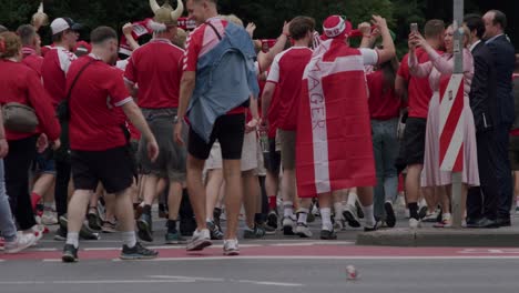 Profile-view-of-Danish-fans-walk-to-the-stadium-ahead-of-Denmark-match-in-Frankfurt,-Germany-at-UEFA-EURO-Cup-2024