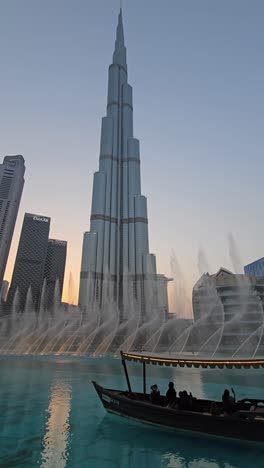 The-world's-tallest-building,-Burj-Khalifa,-set-against-the-dazzling-display-of-the-Dubai-Fountain-show-at-Dubai-Mall,-United-Arab-Emirates