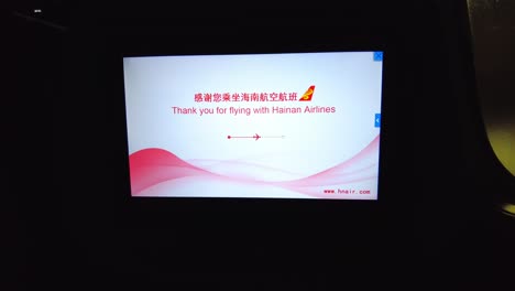 In-flight-screen-displaying-a-thank-you-message-from-Hainan-Airlines,-close-up