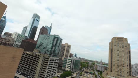 FPV-drone-shot-over-Vine-Street-and-revealing-downtown-skyscrapers-and-City-Hall