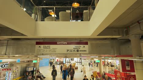 Footage-shows-a-descent-through-Ditton-shopping-centre,-with-shops-and-people-visible