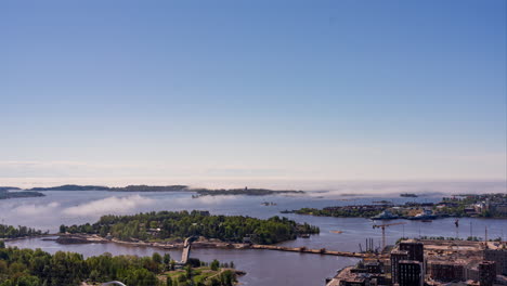 Timelapse-of-sea-fog-moving-over-the-Helsinki-archipelago,-summer-day-in-Finland