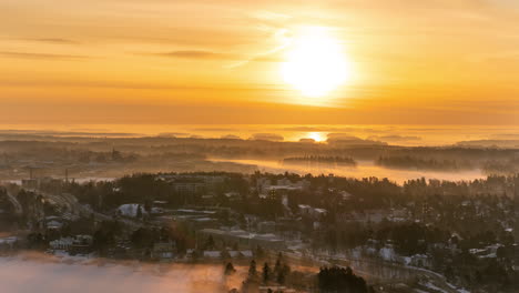 Time-lapse-of-a-foggy-sunrise-above-the-Kulosaari-island,-winter-in-Helsinki