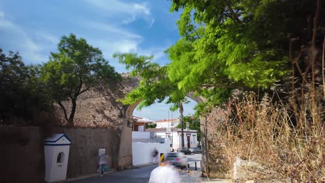 Timelapse-of-Porta-da-Praça-de-Armas-in-Lagos,-Portugal-on-a-sunny-day-with-trees-in-view