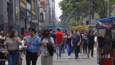 Crowd-of-people-walking-in-busy-central-district-of-Mexico-CIty,-day-time