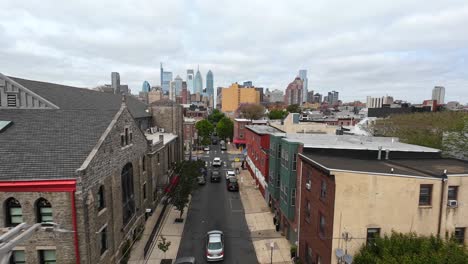 City-street-with-row-houses-in-Philadelphia,-PA