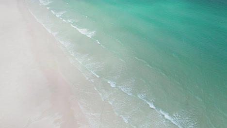 Drone-Shot-of-White-Sandy-Shore-and-Turquoise-Ocean-Water,-Whitehaven-Beach,-Queensland,-Australia