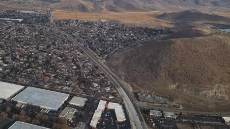 Aerial-View-of-Reno-Nevada-USA-Residential-Suburbs-and-Water-Reservoir,-Airplane-Passenger-POV