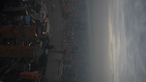 Aerial-night-view-of-Shanghai-and-Huangpu-River-in-vertical