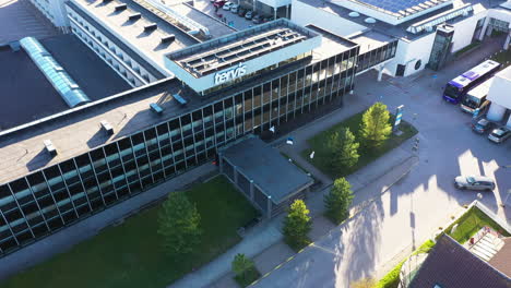 Aerial-view-of-Tervis-Spa-Building-in-Pärnu,-Estonia-during-golden-hour-sunlight