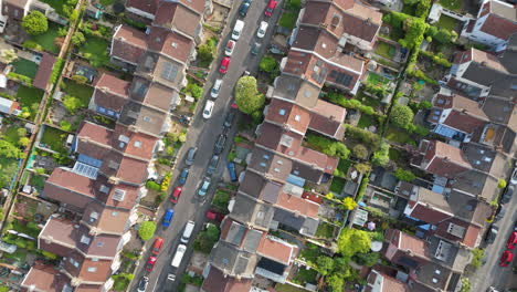 Residential-street-in-Knowle-neighborhood-Bristol-with-parked-cars,-top-drone