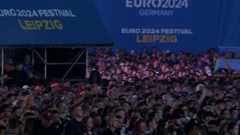 Large-crowd-at-Euro-2024-festival-in-Leipzig-Germany-enjoying-public-viewing-event-at-night