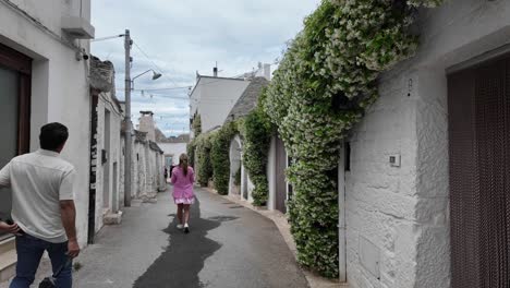 Walking-POV-on-the-Narrow-Streets-of-Alberobello-in-the-province-of-Bari-in-the-Apulia-region-of-Italy