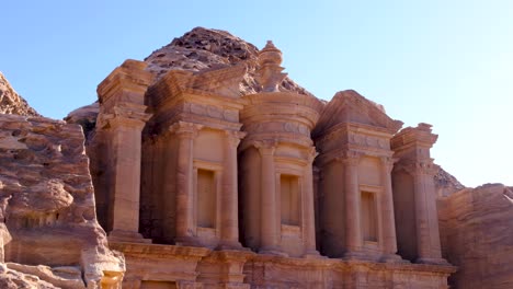 View-of-upper-levels-of-The-Monastery-Ed-Deir-building-carved-into-mountains-of-Petra-City-in-Jordan