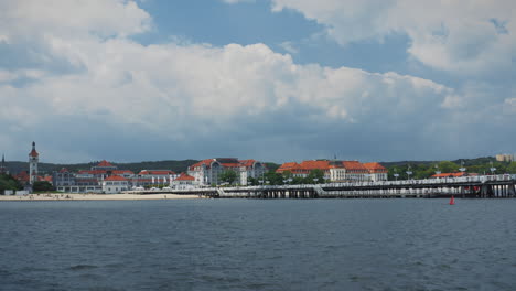 Sopot---coastal-town-with-picturesque-waterfront,-featuring-the-Sopot-Pier,-sandy-beach,-distinctive-architecture-with-red-tiled-roofs