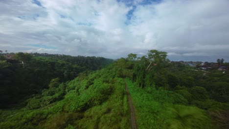 Isolated-by-nature,-people-exercising-along-hidden-ridgeway,-aerial-FPV