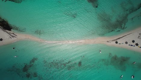 A-sandy-path-through-clear-turquoise-waters-at-cayo-de-agua,-los-roques,-aerial-view