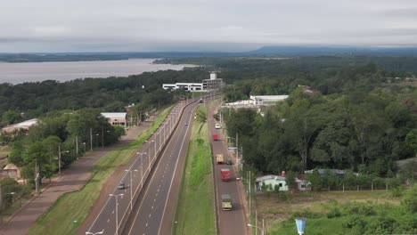 High-quality-aerial-footage-showcasing-the-modern-urban-infrastructure-of-Posadas,-Misiones,-showcasing-parks,-rivers,-and-scenic-landscapes