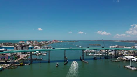 Drone-shot-flying-over-the-Fort-Myers-Beach-Bridge-on-a-sunny-day