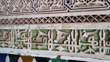 Islamic-art-letters-carving-in-concrete-wall,-decorative-arabic-facade